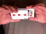 Magician is shown cutting the deck