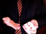 magician shows the second from top card