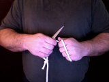 magician winds rope around hand