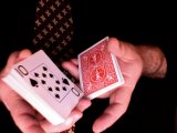 magician cuts the cards again
