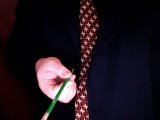magician holds pencil