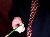 magician twists the pencil