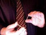 Magician holds the matches between thumbs and fingers