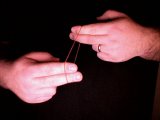 magian puts elastic band over fingers