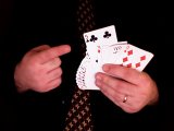 magician fans cards and gives spectator a free choice