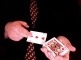 magician turns over the deck