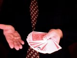 magician reveals the card the wrong way up in the deck