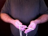 magician pinches rope