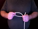 magician makes a loop with the rope