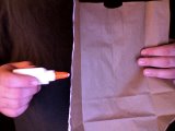magician applues glue to bag edges