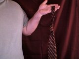 magician shows tie tied