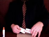 magician glues the two of diamonds