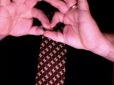 magician holds coins between thumbs and forefingers