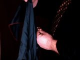 magician drapes handkerchief over coin