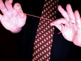 magician stretches the broken elastic band