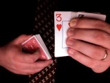 magician catches card with finger tips