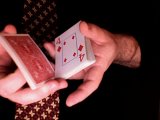 magician cuts the deck