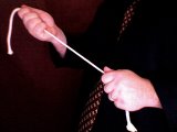 magician pulls the rope slightly