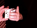 magician places cards on top of jacks