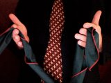 magician holds silk between fingers