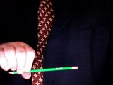 magician twists the pencil